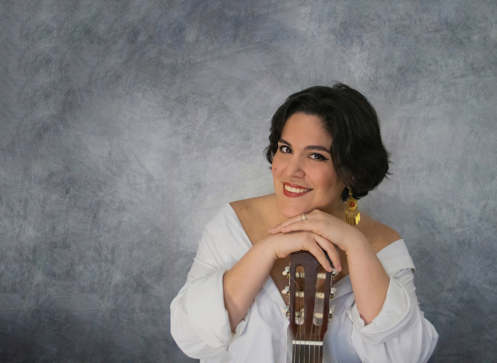 Gabby Cotter with guitar